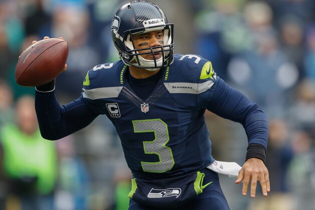 SEATTLE, WA - DECEMBER 29:  Quarterback Russell Wilson #3 of the Seattle Seahawks passes against the St. Louis Rams at CenturyLink Field on December 29, 2013 in Seattle, Washington.  (Photo by Otto Greule Jr/Getty Images)