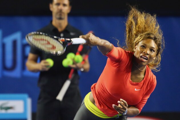 MELBOURNE, AUSTRALIA - JANUARY 06:  Serena Williams of the USA serves as her coach Patrick Mouratoglou looks on during a practice session ahead of the 2014 Australian Open at Melbourne Park on January 6, 2014 in Melbourne, Australia.  (Photo by Scott Barbour/Getty Images)