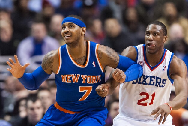 Jan 26, 2013; Philadelphia, PA, USA; New York Knicks forward Carmelo Anthony (7) battles for position with Philadelphia 76ers forward Thaddeus Young (21) during the first quarter at the Wells Fargo Center. The Sixers defeated the Knicks 97-80. Mandatory Credit: Howard Smith-USA TODAY Sports