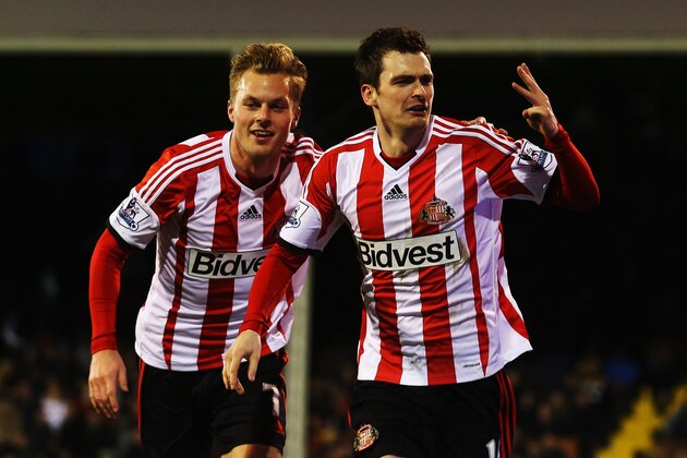 LONDON, ENGLAND - JANUARY 11:  Adam Johnson (R) of Sunderland celebrates with team mate Sebastian Larsson (L) after scoring a hat trick during the Barclays Premier League match between Fulham and Sunderland at Craven Cottage on January 11, 2014 in London, England.  (Photo by Clive Rose/Getty Images)
