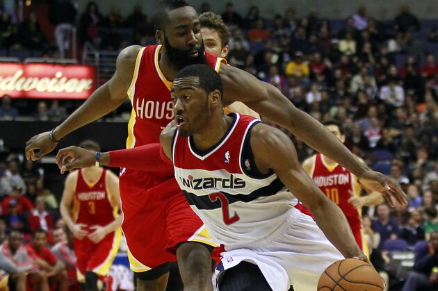 February 23, 2013; Washington, DC, USA; Washington Wizards point guard John Wall (2) dribbles the ball as Houston Rockets shooting guard James Harden (13) defends in the second quarter at Verizon Center. Mandatory Credit: Geoff Burke-USA TODAY Sports