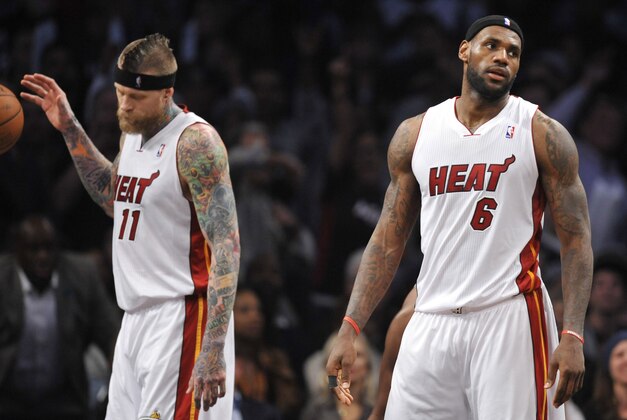 Jan 10, 2014; Brooklyn, NY, USA; Miami Heat small forward LeBron James (6) reacts after fouling out against the Brooklyn Nets during the first overtime at Barclays Center. The Brooklyn Nets won the game 104-95 in double overtime. Mandatory Credit: Joe Camporeale-USA TODAY Sports