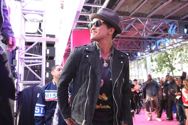 LOS ANGELES, CA - FEBRUARY 20: Singer Bruno Mars walks the T-Mobile Magenta Carpet before the 2011 NBA All-Star Game at the Staples Center on February 20, 2011 in Los Angeles, California. NOTE TO USER: User expressly acknowledges and agrees that, by downloading and or using this photograph, User is consenting to the terms and conditions of the Getty Images License Agreement. Mandatory Copyright Notice: Copyright 2010 NBAE (Photo by Wendi Kaminski/NBAE via Getty Images) LOS ANGELES, CA - FEBRUARY 20: Singer Bruno Mars walks the T-Mobile Magenta Carpet before the 2011 NBA All-Star Game at the Staples Center on February 20, 2011 in Los Angeles, California. NOTE TO USER: User expressly acknowledges and agrees that, by downloading and or using this photograph, User is consenting to the terms and conditions of the Getty Images License Agreement. Mandatory Copyright Notice: Copyright 2010 NBAE (Photo by Wendi Kaminski/NBAE via Getty Images)