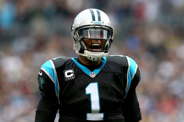 CHARLOTTE, NC - DECEMBER 22:  Cam Newton #1 of the Carolina Panthers celebrates after a touchdown by teammate DeAngelo Williams #34 during their game against the New Orleans Saints at Bank of America Stadium on December 22, 2013 in Charlotte, North Carolina.  (Photo by Streeter Lecka/Getty Images)