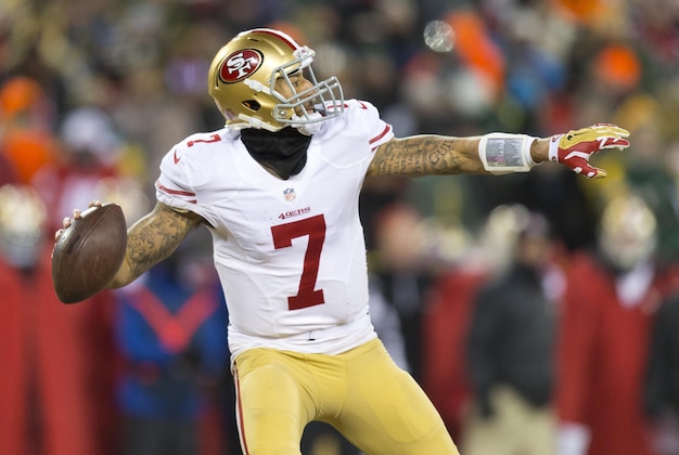 Jan 5, 2014; Green Bay, WI, USA; San Francisco 49ers quarterback Colin Kaepernick (7) throws a pass during the fourth quarter against the Green Bay Packers during the 2013 NFC wild card playoff football game at Lambeau Field.  San Francisco won 23-20.  Mandatory Credit: Jeff Hanisch-USA TODAY Sports
