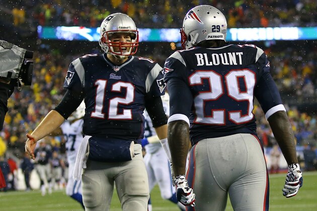 FOXBORO, MA - JANUARY 11:  LeGarrette Blount #29  of the New England Patriots celebrates with teammate Tom Brady #12 in the end zone after scoring a 2 yard touchdown in the first quarter the Indianapolis Colts during the AFC Divisional Playoff game at Gillette Stadium on January 11, 2014 in Foxboro, Massachusetts.  (Photo by Al Bello/Getty Images)