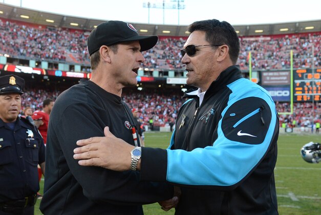 November 10, 2013; San Francisco, CA, USA; San Francisco 49ers head coach Jim Harbaugh (left) shakes hands with Carolina Panthers head coach Ron Rivera (right) after the game at Candlestick Park. The Panthers defeated the 49ers 10-9. Mandatory Credit: Kyle Terada-USA TODAY Sports