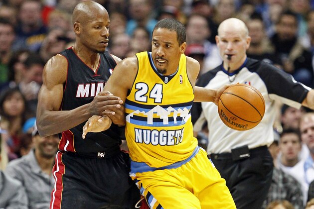 Dec 30, 2013; Denver, CO, USA; Miami Heat shooting guard Ray Allen (34) guards Denver Nuggets point guard Andre Miller (24) in the fourth quarter at the Pepsi Center. The Heat defeated the Nuggets 97-94. Mandatory Credit: Isaiah J. Downing-USA TODAY Sports