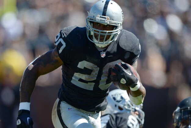 Sep 15, 2013; Oakland, CA, USA; Oakland Raiders running back Darren McFadden (20) carries the ball in the first half against the Jacksonville Jaguars at O.co Coliseum. Mandatory Credit: Kirby Lee-USA TODAY Sports