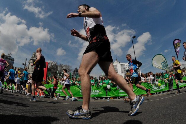 Apr 21, 2013; London, United Kingdom; Fun runners compete during the Virgin London Marathon at the 22 mile mark. Mandatory Credit: Leo Mason-USA TODAY Sports