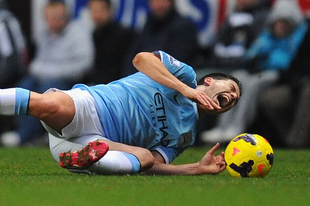 NEWCASTLE UPON TYNE, ENGLAND - JANUARY 12: Newcastle player Mapou Yanga-Mbiwa (l) fouls Samir Nasri who is later stretchered off during the Barclays Premier League match between Newcastle United and Manchestre City at St James' Park on January 12, 2014 in Newcastle upon Tyne, England. (Photo by Stu Forster/Getty Images) NEWCASTLE UPON TYNE, ENGLAND - JANUARY 12: Newcastle player Mapou Yanga-Mbiwa (l) fouls Samir Nasri who is later stretchered off during the Barclays Premier League match between Newcastle United and Manchestre City at St James' Park on January 12, 2014 in Newcastle upon Tyne, England. (Photo by Stu Forster/Getty Images)