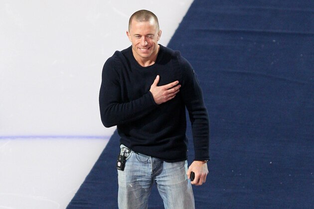 Mar 13, 2013; Montreal, Quebec, CAN; UFC World champion Georges St-Pierre reacts before the game of Montreal Canadiens against Ottawa Senators at the Bell Centre. Mandatory Credit: Jean-Yves Ahern-USA TODAY Sports