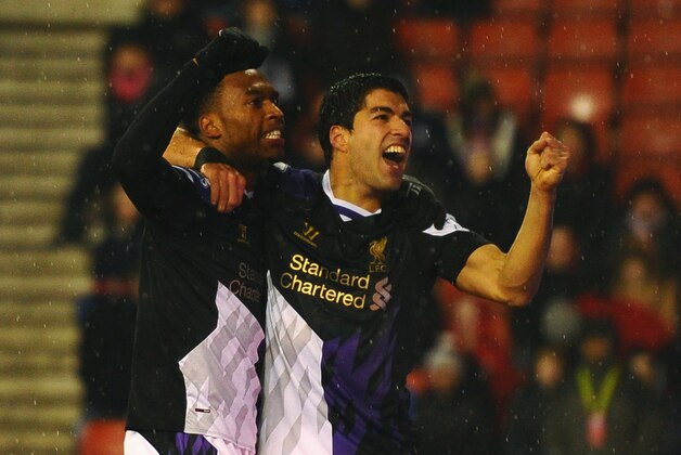 STOKE ON TRENT, ENGLAND - JANUARY 12:  Luis Suarez of Liverpool celebrates with Daniel Sturridge (L) as he scores their fourth goal during the Barclays Premier League match between Stoke City and Liverpool at Britannia Stadium on January 12, 2014 in Stoke on Trent, England.  (Photo by Laurence Griffiths/Getty Images)