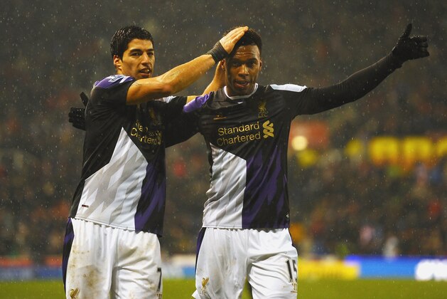 STOKE ON TRENT, ENGLAND - JANUARY 12:  Daniel Sturridge of Liverpool (R) celebrates with Luis Suarez as he scores their fifth goal during the Barclays Premier League match between Stoke City and Liverpool at Britannia Stadium on January 12, 2014 in Stoke on Trent, England.  (Photo by Laurence Griffiths/Getty Images)
