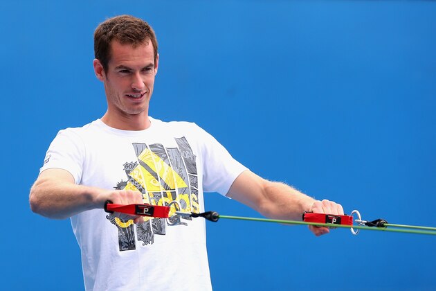 MELBOURNE, AUSTRALIA - JANUARY 12:  Andy Murray of Great Britain stretches during practice ahead of the 2014 Australian Open at Melbourne Park on January 12, 2014 in Melbourne, Australia.  (Photo by Quinn Rooney/Getty Images)