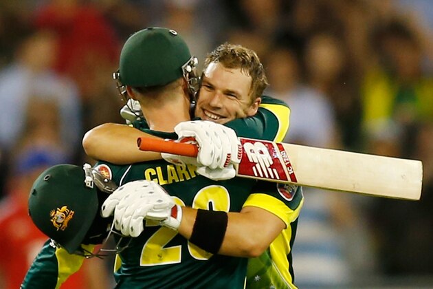MELBOURNE, AUSTRALIA - JANUARY 12:  Michael Clarke congratulates Aaron Finch of Australia after he scored 100 runs during game one of the one day international series between Australia and England at Melbourne Cricket Ground on January 12, 2014 in Melbourne, Australia.  (Photo by Darrian Traynor/Getty Images)