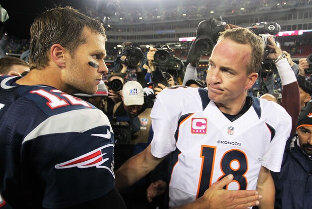 Oct 7, 2012; Foxborough, MA, USA; New England Patriots quarterback Tom Brady (12) shakes hands with Denver Broncos quarterback Peyton Manning (18) following the game at Gillette Stadium. The Patriots defeated the Broncos 31-21. Mandatory Credit: Stew Milne-USA TODAY Sports