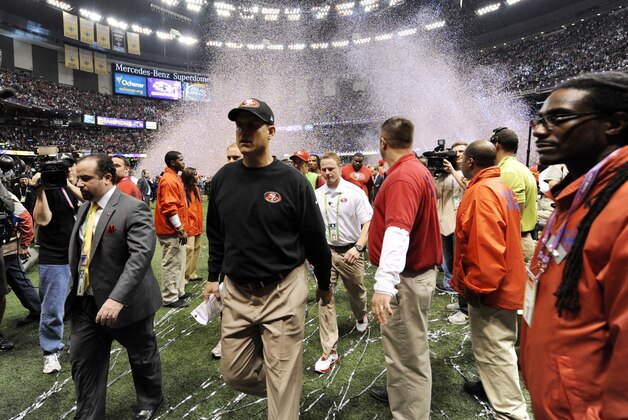 Feb 3, 2013; New Orleans, LA, USA; San Francisco 49ers head coach Jim Harbaugh leaves the field after being defeated by the Baltimore Ravens in Super Bowl XLVII at the Mercedes-Benz Superdome. Mandatory Credit: Robert Deutsch-USA TODAY Sports