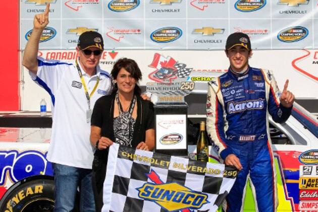 Chase Elliott (far right) celebrated his first truck series victory with dad Bill (far left) and mom Cindy (middle).