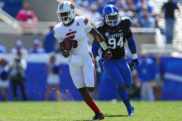 LEXINGTON, KY - SEPTEMBER 14:  Teddy Bridgewater #5 of the Louisville Cardinals runs with the ball  during the game against the Kentucky Wildcats at Commonwealth Stadium on September 14, 2013 in Lexington, Kentucky.  (Photo by Andy Lyons/Getty Images)