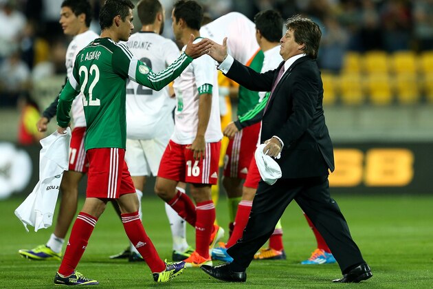 WELLINGTON, NEW ZEALAND - NOVEMBER 20:  Coach Miguel Herrera of Mexico congratulates Paul Aguilar after the final whistle during leg 2 of the FIFA World Cup Qualifier match between the New Zealand All Whites and Mexico at Westpac Stadium on November 20, 2013 in Wellington, New Zealand.  (Photo by Hagen Hopkins/Getty Images)