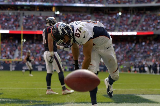 Dec 22, 2013; Houston, TX, USA; Denver Broncos wide receiver Eric Decker (87) spikes the football after scoring a touchdown against the Houston Texans during the second half at Reliant Stadium. The Broncos won 37-13. Mandatory Credit: Thomas Campbell-USA TODAY Sports