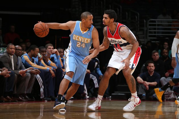 WASHINGTON, DC - DECEMBER 8: Andre Miller #24 of the Denver Nuggets drives against Glen Rice #14 of the Washington Wizards during the game at the Verizon Center on December 8, 2013 in Washington, DC. NOTE TO USER: User expressly acknowledges and agrees that, by downloading and or using this photograph, User is consenting to the terms and conditions of the Getty Images License Agreement. Mandatory Copyright Notice: Copyright 2013 NBAE (Photo by Ned Dishman/NBAE via Getty Images)
