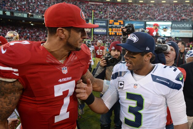 December 8, 2013; San Francisco, CA, USA; San Francisco 49ers quarterback Colin Kaepernick (7) shakes hands with Seattle Seahawks quarterback Russell Wilson (3) after the game at Candlestick Park. The 49ers defeated the Seahawks 19-17. Mandatory Credit: Kyle Terada-USA TODAY Sports