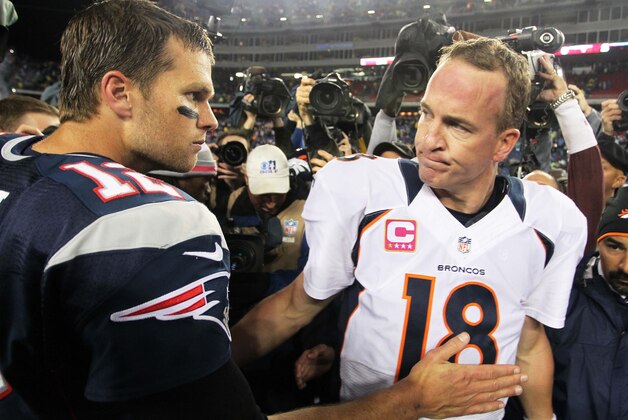 Oct 7, 2012; Foxborough, MA, USA; New England Patriots quarterback Tom Brady (12) shakes hands with Denver Broncos quarterback Peyton Manning (18) following the game at Gillette Stadium. The Patriots defeated the Broncos 31-21. Mandatory Credit: Stew Milne-USA TODAY Sports