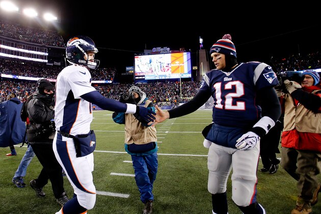 FOXBORO, MA - NOVEMBER 24: Quarterback Peyton Manning #18 of the Denver Broncos and quarterback Tom Brady #12 of the New England Patriots shake hands after the New England Patriots defeated the Denver Broncos 34-31 in overtime at Gillette Stadium on November 24, 2013 in Foxboro, Massachusetts.  (Photo by Jim Rogash/Getty Images)