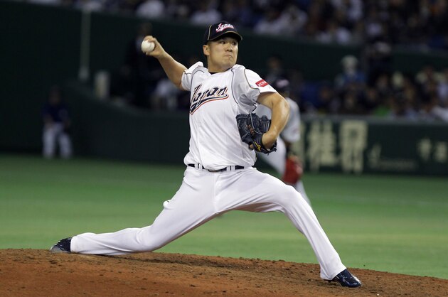 TOKYO, JAPAN - MARCH 12:  Pitcher Masahiro Tanaka # 17 of Japan pitches in the fifth inning during the World Baseball Classic Second Round Pool 1 game between Japan and the Netherlands at Tokyo Dome on March 12, 2013 in Tokyo, Japan.  (Photo by Chung Sung-Jun/Getty Images)
