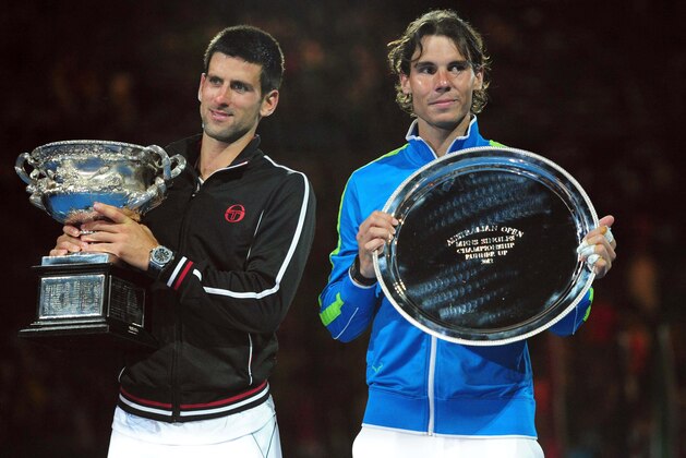 Jan 29, 2012; Melbourne, AUSTRALIA; Novak Djokovic (SRB), left, and Rafael Nadal (ESP) after the men's singles finals of the 2012 Australian Open at Melbourne Park.  Djokovic won 5-7, 6-4, 6-2, 6-7, 7-5. Mandatory Credit: Pierre Lahalle/Presse Sports via USA TODAY Sports