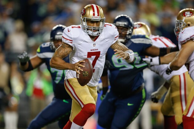 SEATTLE, WA - SEPTEMBER 15:  Quarterback Colin Kaepernick #7 of the San Francisco 49ers rushes against the Seattle Seahawks at CenturyLink Field on September 15, 2013 in Seattle, Washington. The Seahawks defeated the 49ers 29-3.  (Photo by Otto Greule Jr/Getty Images)