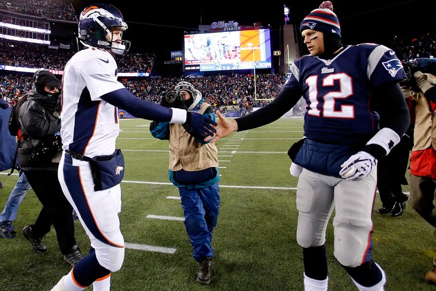 FOXBORO, MA - NOVEMBER 24: Quarterback Peyton Manning #18 of the Denver Broncos and quarterback Tom Brady #12 of the New England Patriots shake hands after the New England Patriots defeated the Denver Broncos 34-31 in overtime at Gillette Stadium on November 24, 2013 in Foxboro, Massachusetts.  (Photo by Jim Rogash/Getty Images)