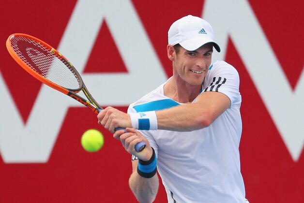 MELBOURNE, AUSTRALIA - JANUARY 10:  Andy Murray of Great Britain plays a backhand during his match against Lleyton Hewitt of Australia during day three of the AAMI Classic at Kooyong on January 10, 2014 in Melbourne, Australia.  (Photo by Scott Barbour/Getty Images)