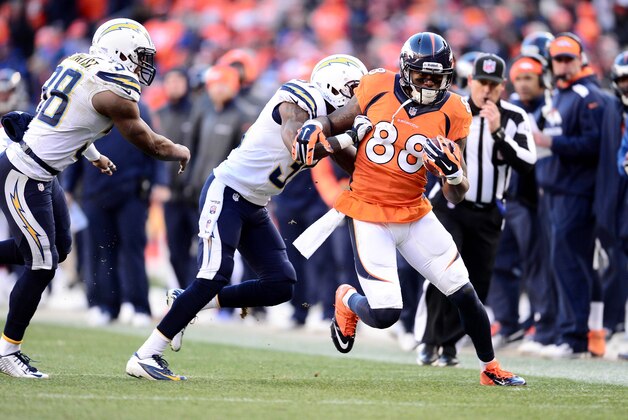 Jan 12, 2014; Denver, CO, USA; Denver Broncos wide receiver Demaryius Thomas (88) is pushed out of bounds by San Diego Chargers cornerback Richard Marshall (31) in the second quarter during the 2013 AFC divisional playoff football game at Sports Authority Field at Mile High. Mandatory Credit: Ron Chenoy-USA TODAY Sports