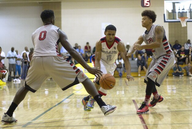 Jul 14, 2013; North Augusta, SC, USA; E1T1 Elite player Joel Berry (11) drives to the basket while being defended by CP3 All Stars players LJ Peak (0) and Nate Mason (2) during the final round of the 2013 Nike Peach Jam at the Riverview Park Activities Center. Mandatory Credit: Joshua S. Kelly-USA TODAY Sports Jul 14, 2013; North Augusta, SC, USA; E1T1 Elite player Joel Berry (11) drives to the basket while being defended by CP3 All Stars players LJ Peak (0) and Nate Mason (2) during the final round of the 2013 Nike Peach Jam at the Riverview Park Activities Center. Mandatory Credit: Joshua S. Kelly-USA TODAY Sports