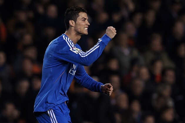 VALENCIA, SPAIN - DECEMBER 22: Cristiano Ronaldo of Real Madrid celebrates after scoring during the La Liga match between Valencia CF and Real Madrid CF at Estadio Mestalla on December 22, 2013 in Valencia, Spain. (Photo by Manuel Queimadelos Alonso/Getty Images) VALENCIA, SPAIN - DECEMBER 22: Cristiano Ronaldo of Real Madrid celebrates after scoring during the La Liga match between Valencia CF and Real Madrid CF at Estadio Mestalla on December 22, 2013 in Valencia, Spain. (Photo by Manuel Queimadelos Alonso/Getty Images)