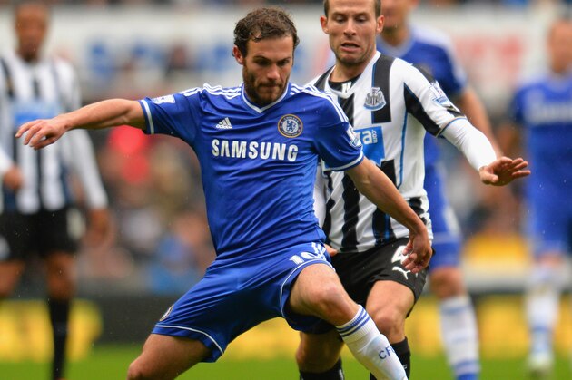 NEWCASTLE UPON TYNE, ENGLAND - NOVEMBER 02:  Juan Mata of Chelsea is marshalled by Yohan Cabaye of Newcastle United during the Barclays Premier League match between Newcastle United and Chelsea at St James' Park on November 2, 2013 in Newcastle upon Tyne, England.  (Photo by Shaun Botterill/Getty Images)