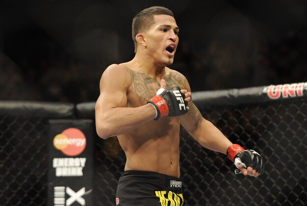 Jan 26, 2013; Chicago, IL, USA;  Anthony Pettis celebrates after defeating Donald Cerrone (not pictured) during UFC on FOX 6 at the United Center.  Mandatory Credit: David Banks-USA TODAY Sports