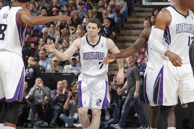 SACRAMENTO, CA - JANUARY 10:  Jimmer Fredette #7 of the Sacramento Kings celebrates with teammates during a break in action against the Orlando Magic at Sleep Train Arena on January 10, 2014 in Sacramento, California. NOTE TO USER: User expressly acknowledges and agrees that, by downloading and or using this photograph, User is consenting to the terms and conditions of the Getty Images Agreement. Mandatory Copyright Notice: Copyright 2014 NBAE (Photo by Rocky Widner/NBAE via Getty Images)