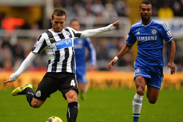 NEWCASTLE UPON TYNE, ENGLAND - NOVEMBER 02:  Ashley Cole of Chelsea closes down Yohan Cabaye of Newcastle United during the Barclays Premier League match between Newcastle United and Chelsea at St James' Park on November 2, 2013 in Newcastle upon Tyne, England.  (Photo by Shaun Botterill/Getty Images)