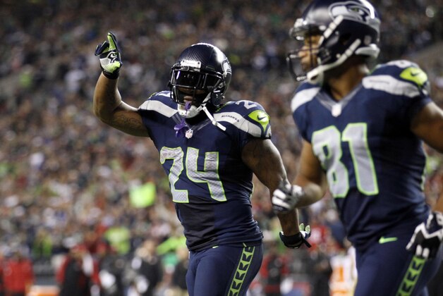 Sep 15, 2013; Seattle, WA, USA; Seattle Seahawks running back Marshawn Lynch (24) celebrates after rushing for a touchdown against the San Francisco 49ers during the third quarter at CenturyLink Field. Mandatory Credit: Joe Nicholson-USA TODAY Sports