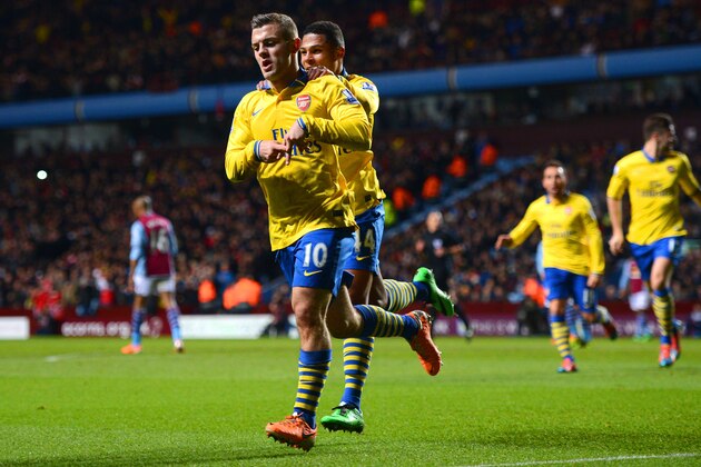 BIRMINGHAM, ENGLAND - JANUARY 13:  Jack Wilshere of Arsenal ceelbrates scoring the opening goal with Serge Gnabry of Arsenal during the Barclays Premier League match between Aston Villa and Arsenal at Villa Park on January 13, 2014 in Birmingham, England.  (Photo by Michael Regan/Getty Images)