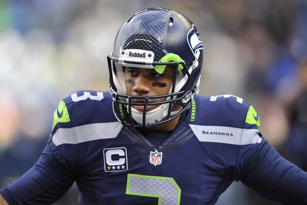 Jan 11, 2014; Seattle, WA, USA; Seattle Seahawks quarterback Russell Wilson (3) warms up before the 2013 NFC divisional playoff football game against the New Orleans Saints at CenturyLink Field. Mandatory Credit: Steven Bisig-USA TODAY Sports