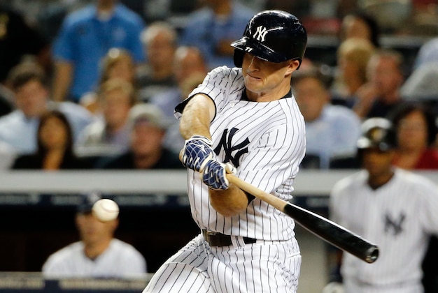 Sep 4, 2013; Bronx, NY, USA; New York Yankees center fielder Brett Gardner (11) triples to deep left allowing two runners to score during the fourth inning against the Chicago White Sox at Yankee Stadium. Mandatory Credit: Anthony Gruppuso-USA TODAY Sports Sep 4, 2013; Bronx, NY, USA; New York Yankees center fielder Brett Gardner (11) triples to deep left allowing two runners to score during the fourth inning against the Chicago White Sox at Yankee Stadium. Mandatory Credit: Anthony Gruppuso-USA TODAY Sports
