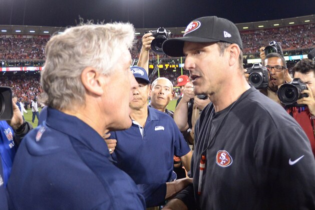 Oct 18, 2012; San Francisco, CA, USA; Seattle Seahawks coach Pete Carroll (left) shakes hands with San Francisco 49ers coach Jim Harbaugh after the game at Candlestick Park. The 49ers defeated the Seahawks 13-6.  Mandatory Credit: Kirby Lee/Image of Sport-USA TODAY Sports