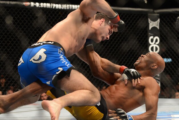 Dec 28, 2013; Las Vegas, NV, USA;    Chris Weidman (red gloves) and Anderson Silva (blue gloves) during their UFC Middleweight Championship Bout at the MGM Grand Garden Arena. Weidman won. Mandatory Credit: Jayne Kamin-Oncea-USA TODAY Sports