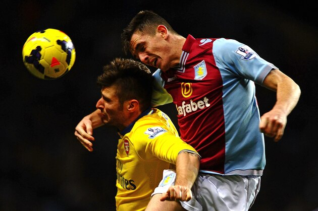 BIRMINGHAM, ENGLAND - JANUARY 13:  Ciaran Clark of Aston Villa climbs above Olivier Giroud of Arsenal ti win the header uring the Barclays Premier League match between Aston Villa and Arsenal at Villa Park on January 13, 2014 in Birmingham, England.  (Photo by Laurence Griffiths/Getty Images)