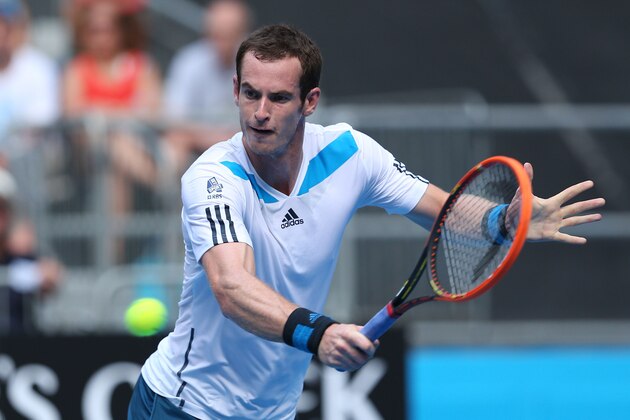 MELBOURNE, AUSTRALIA - JANUARY 14:  Andy Murray of Great Britain plays a backhand in his first round match against Go Soeda of Japan during day two of the 2014 Australian Open at Melbourne Park on January 14, 2014 in Melbourne, Australia.  (Photo by Clive Brunskill/Getty Images)